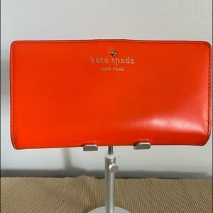 Vivid orange and hot pink Kate Spade wallet.